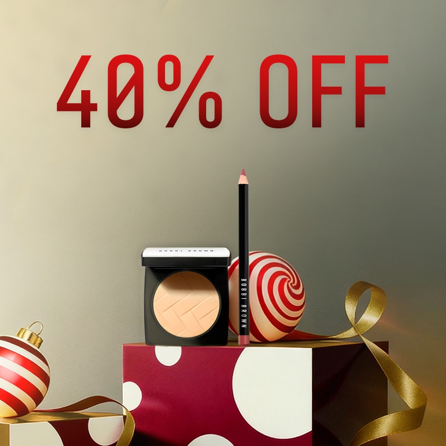 Close up of Long-Wear Cream Shadow Stick with swatch behind on top of a soft-grey background